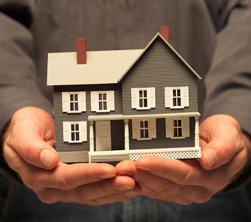 Man holding a house