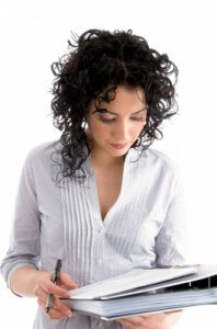 Woman reading paperwork